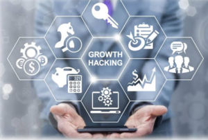 Business professional holding a smartphone with digital growth hacking icons, including analytics, marketing, strategy, customer engagement, and business growth, representing data-driven startup growth.